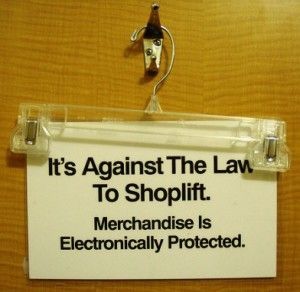 Its Against the law to shoplift sign